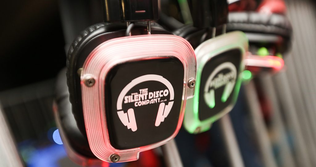 Silent Disco Company DJ booth with multi-channel transmitter and LED headphones
